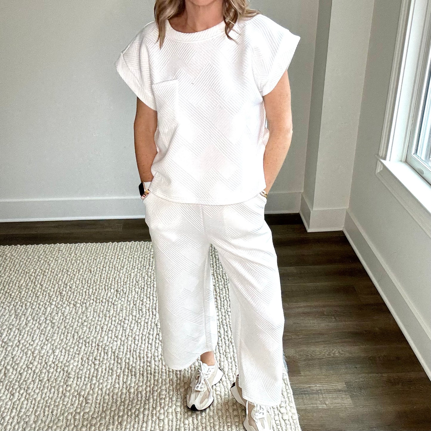White textured fabric pull on wide leg cropped pant with pockets