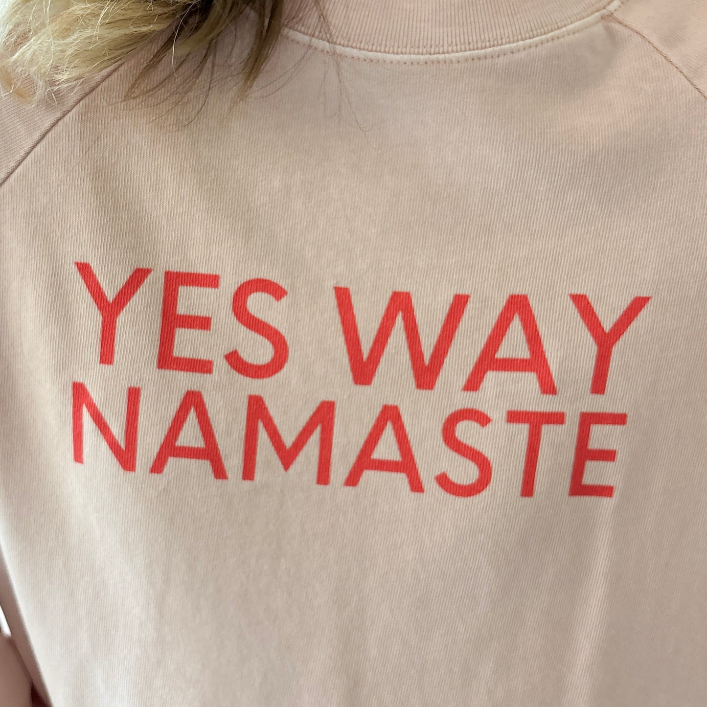 Light pink long raglan sleeve t shirt with raw hem and yes way namaste bright coral print