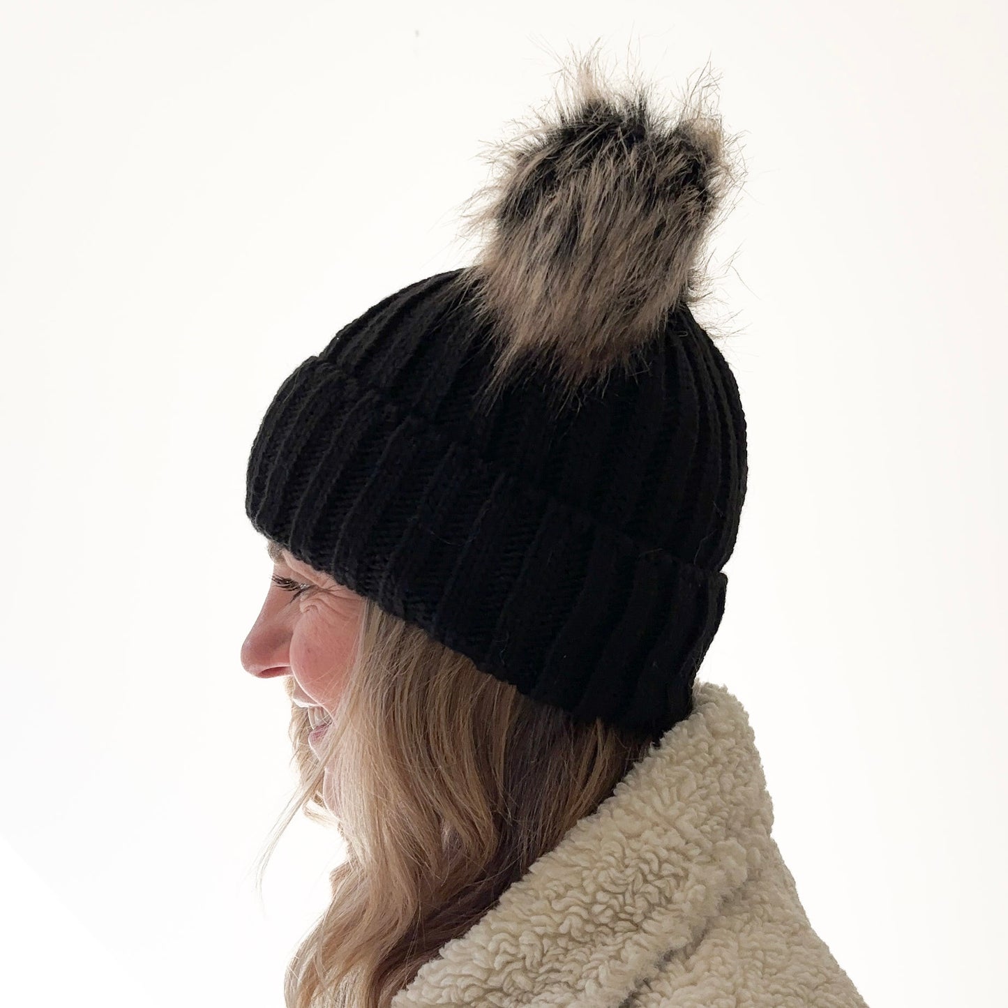 Black rib knit beanie with cuff and double pom poms