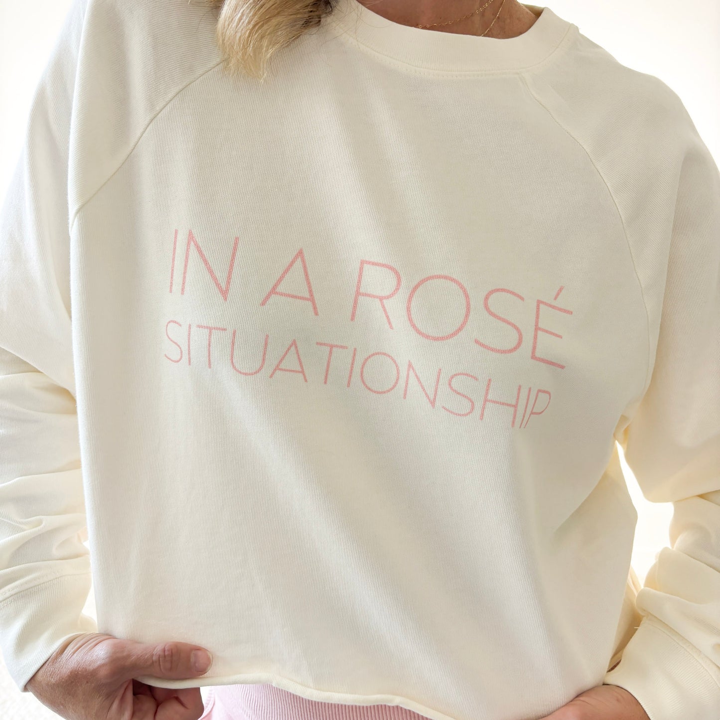 Women's ivory heavy weight crewneck raglan sleeve cropped raw edge t shirt with light pink in a rose situationship print