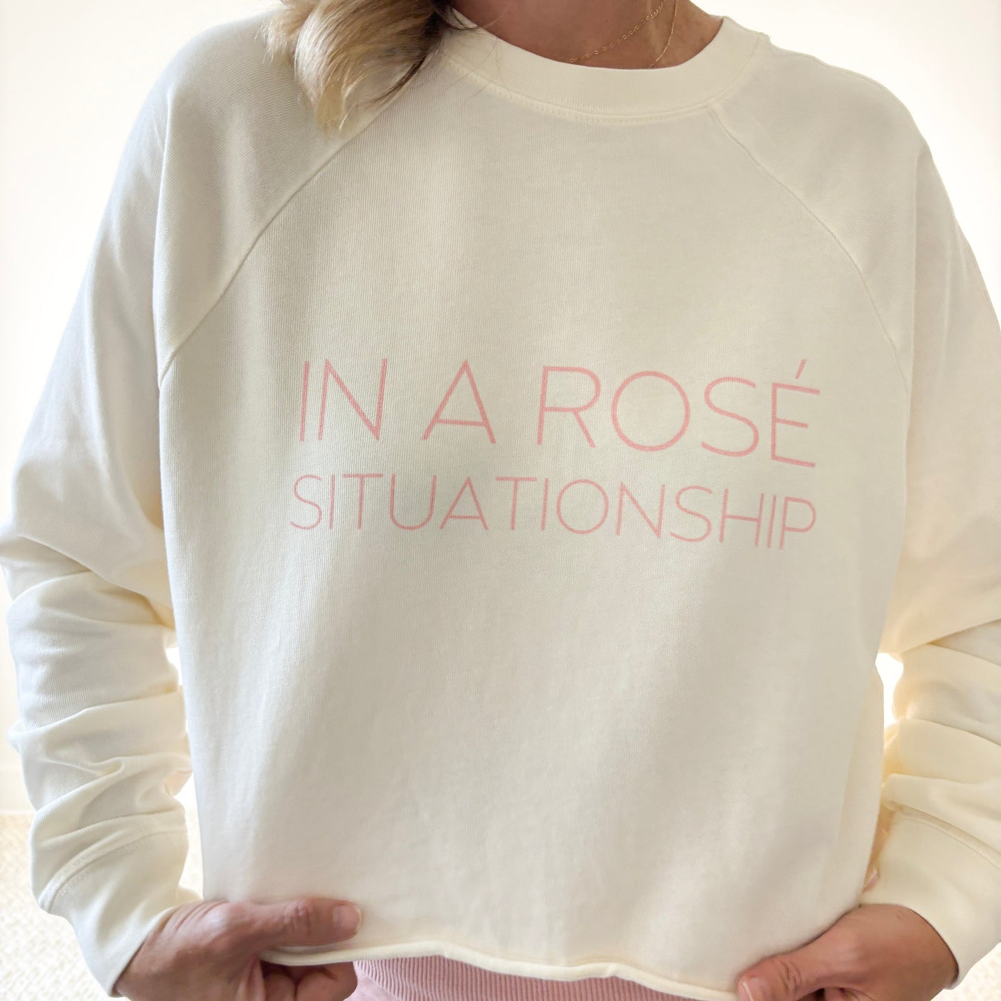 Women's ivory heavy weight crewneck raglan sleeve cropped raw edge t shirt with light pink in a rose situationship print