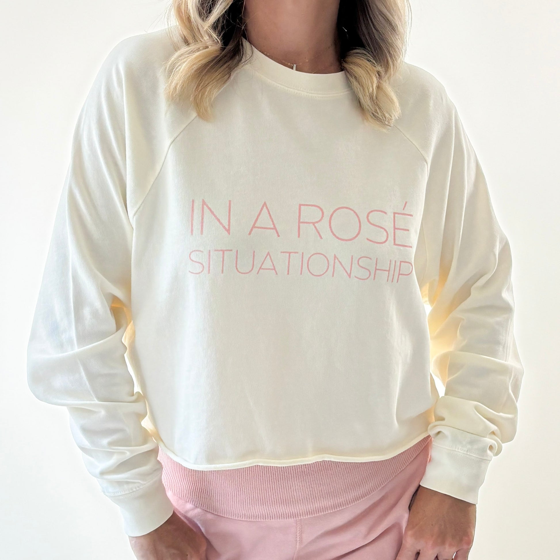 Women's ivory heavy weight crewneck raglan sleeve cropped raw edge t shirt with light pink in a rose situationship print