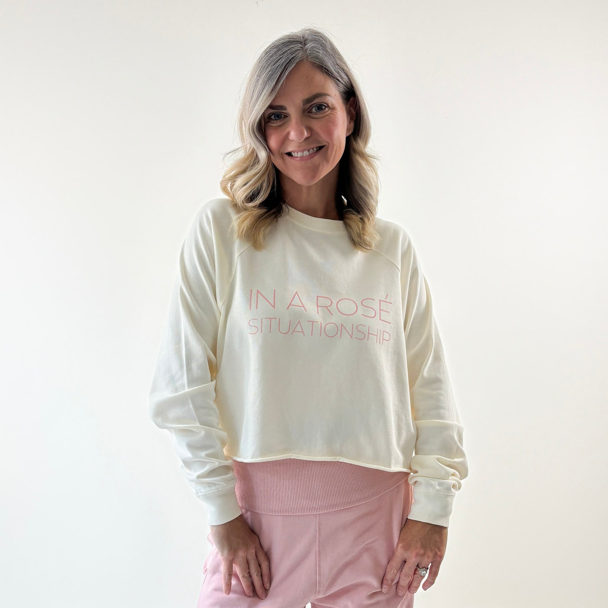 Women's ivory heavy weight crewneck raglan sleeve cropped raw edge t shirt with light pink in a rose situationship print