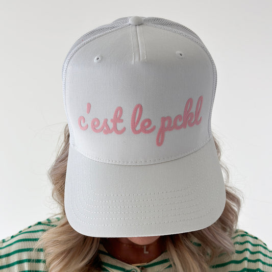 White cotton twill high profile snap back trucker hat with light pink script "c'est le pckl" pickleball hat