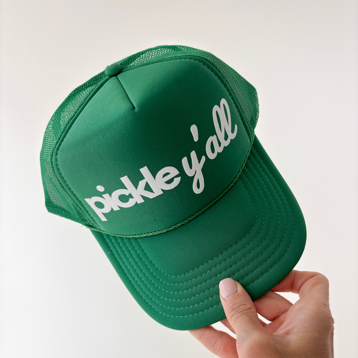 Women's kelly green mid profile foam snapback trucker hat with ivory flocked "pickle y'all" graphic