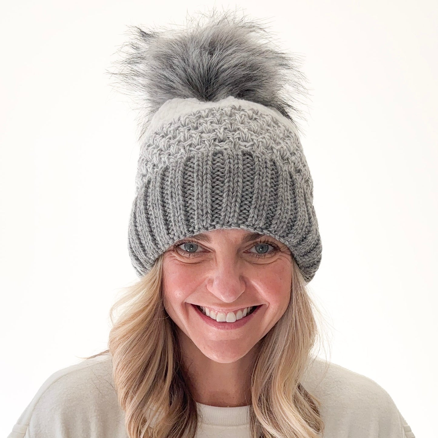 Birdseye knit grey gradient beanie with cuff and oversized grey faux fur pom pom