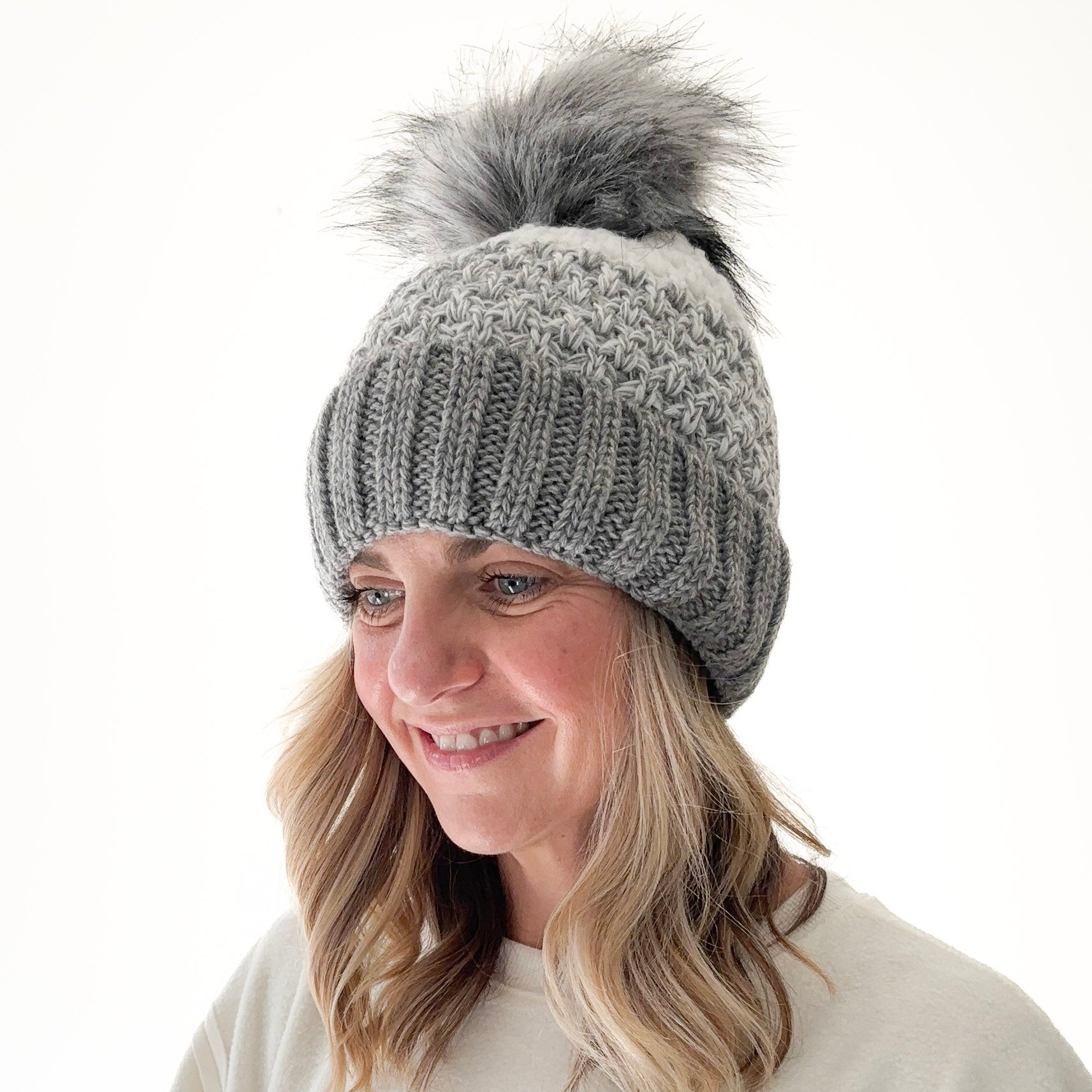 Birdseye knit grey gradient beanie with cuff and oversized grey faux fur pom pom