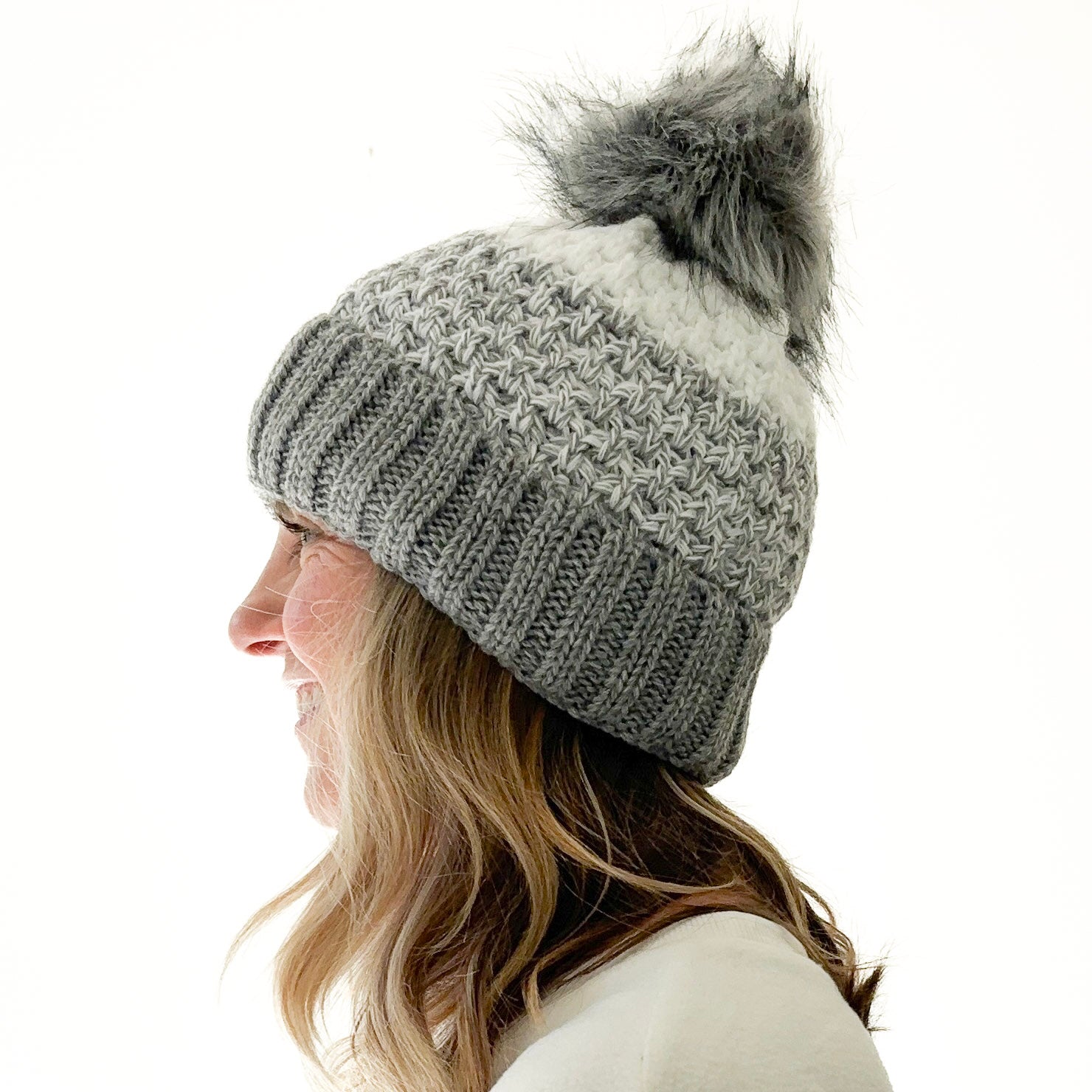 Birdseye knit grey gradient beanie with cuff and oversized grey faux fur pom pom