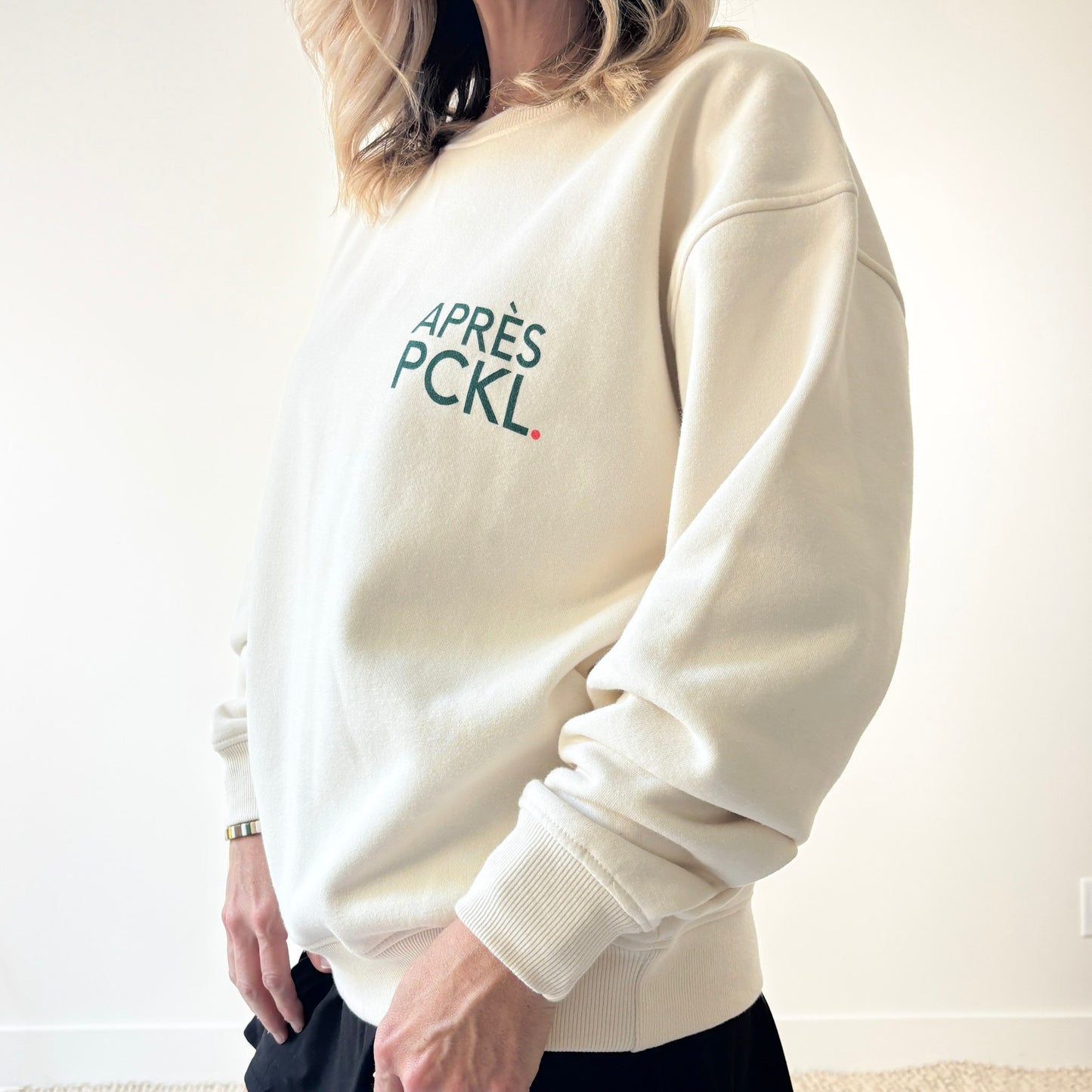 Ivory crew neck fleece sweatshirt with dark green après pckl. pickleball chest print