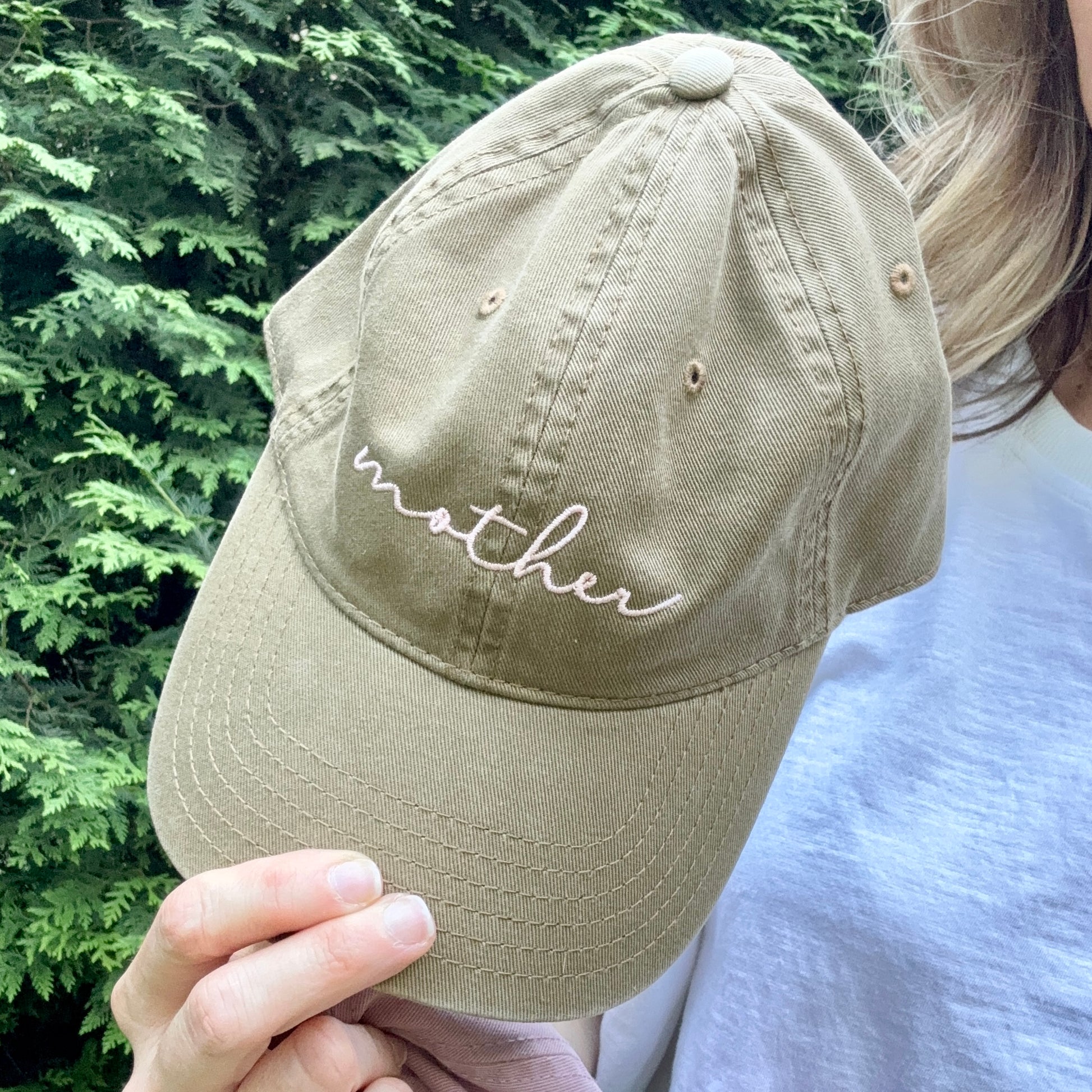 Tan cotton dad hat with back adjuster and light pink mother embroidery