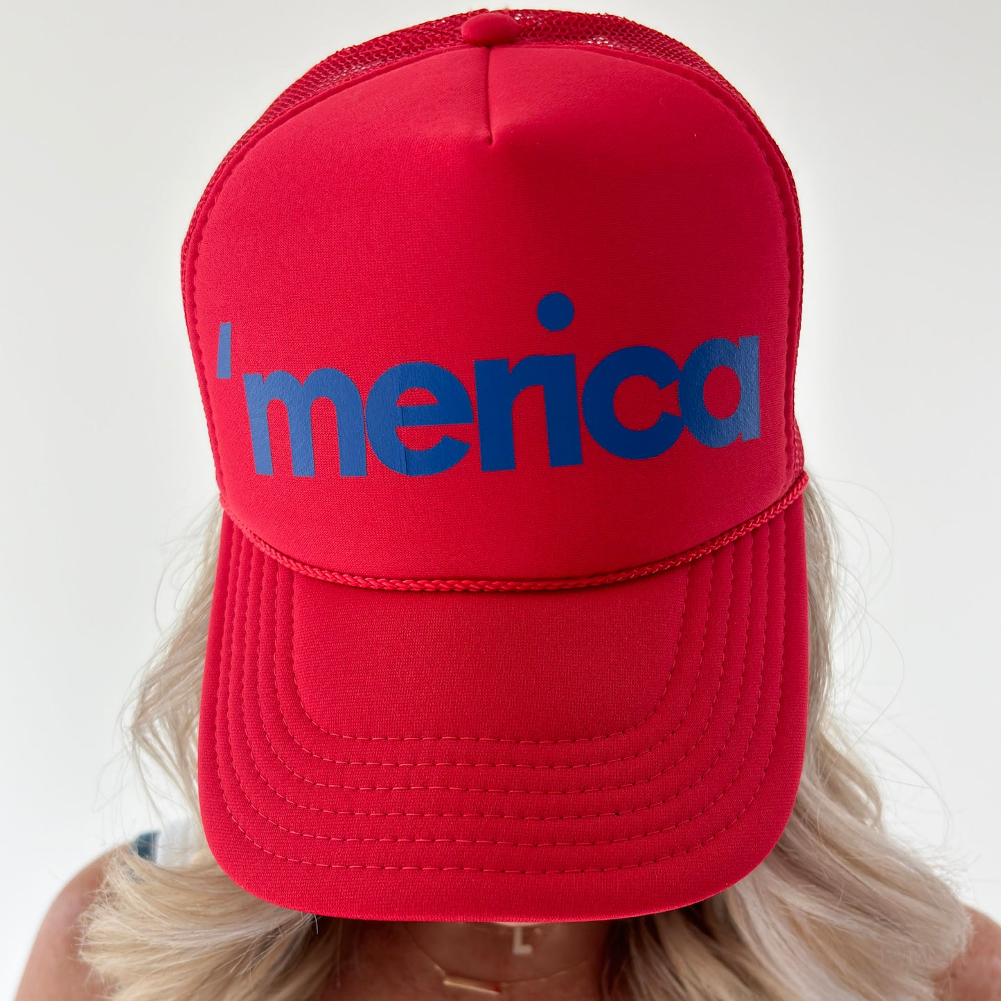Women's mid profile foam bright red trucker hat with blue 'merica printed graphic