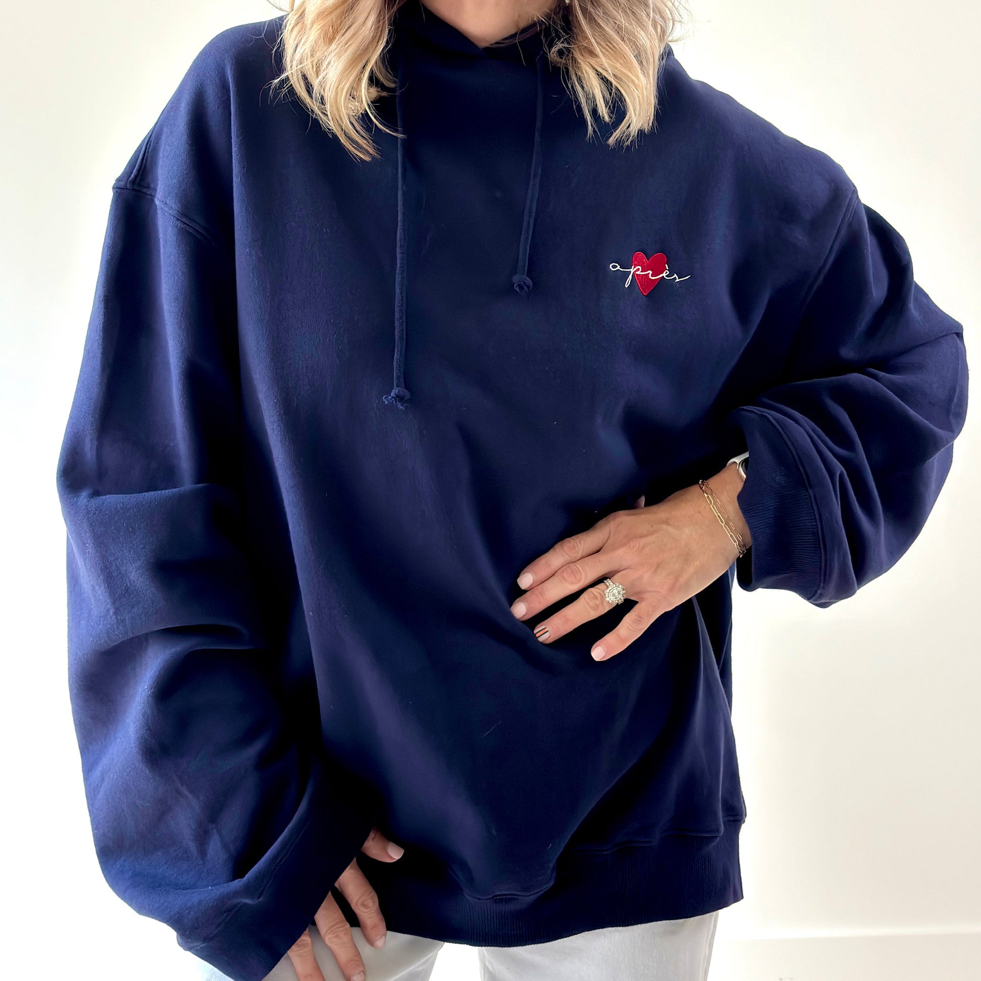 Women's navy pullover hooded oversized light weight fleece sweatshirt with script après and heart embroidery