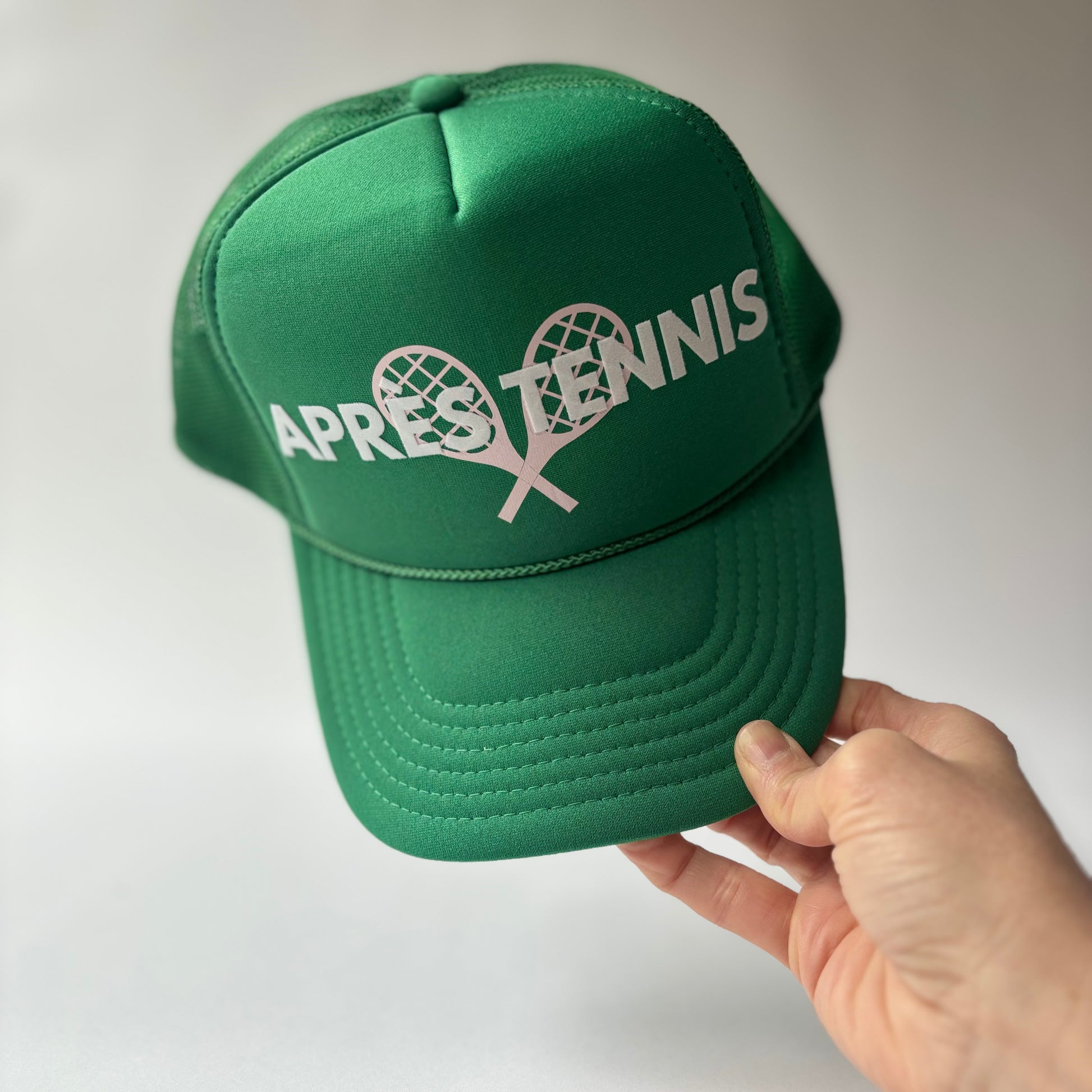 Kelly Green mid profile foam trucker hat with white flocked apres tennis and light pink tennis racket print