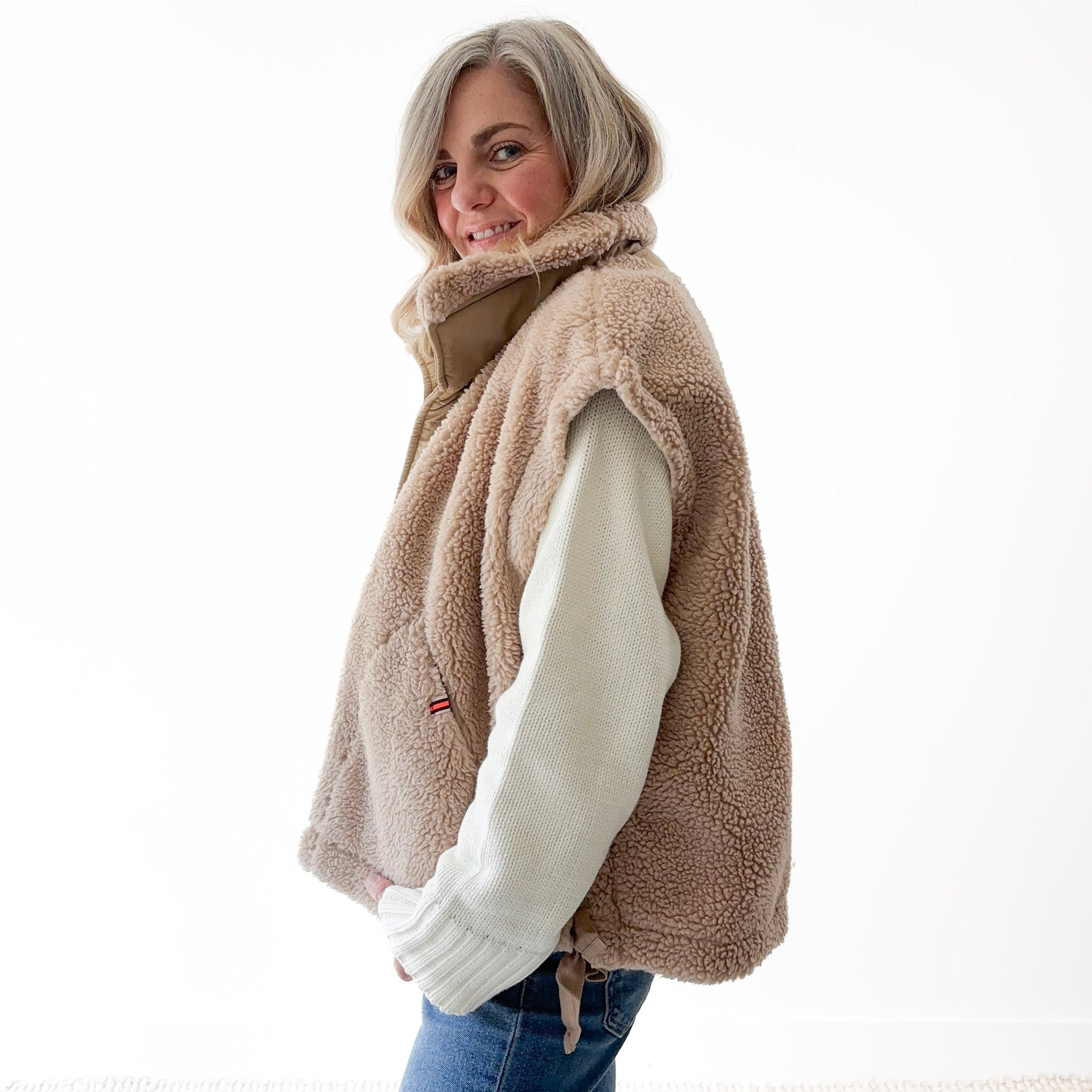 Tan fuzzy sherpa teddy fur snap front vest with pockets and twill tape side tie detail