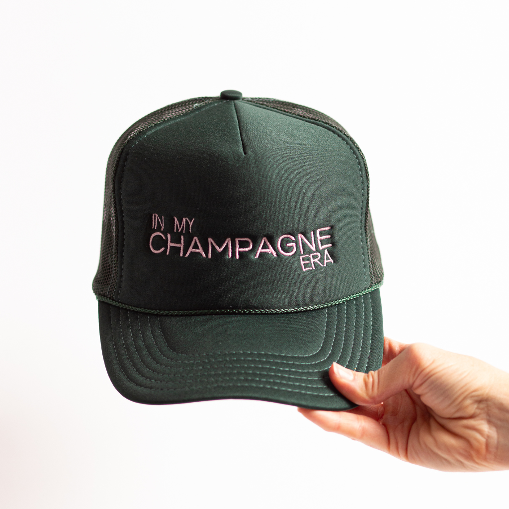 Dark green in my champagne era light pink embroidered high profile trucker hat