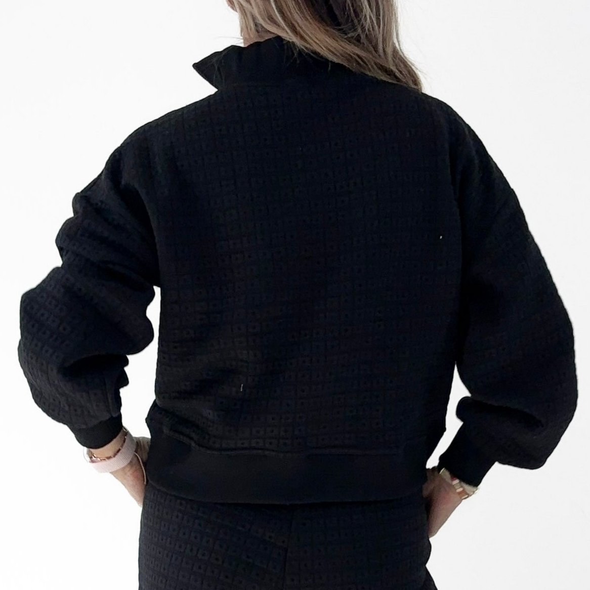 Women's black geometric patterned quarter zip pull over sweatshirt