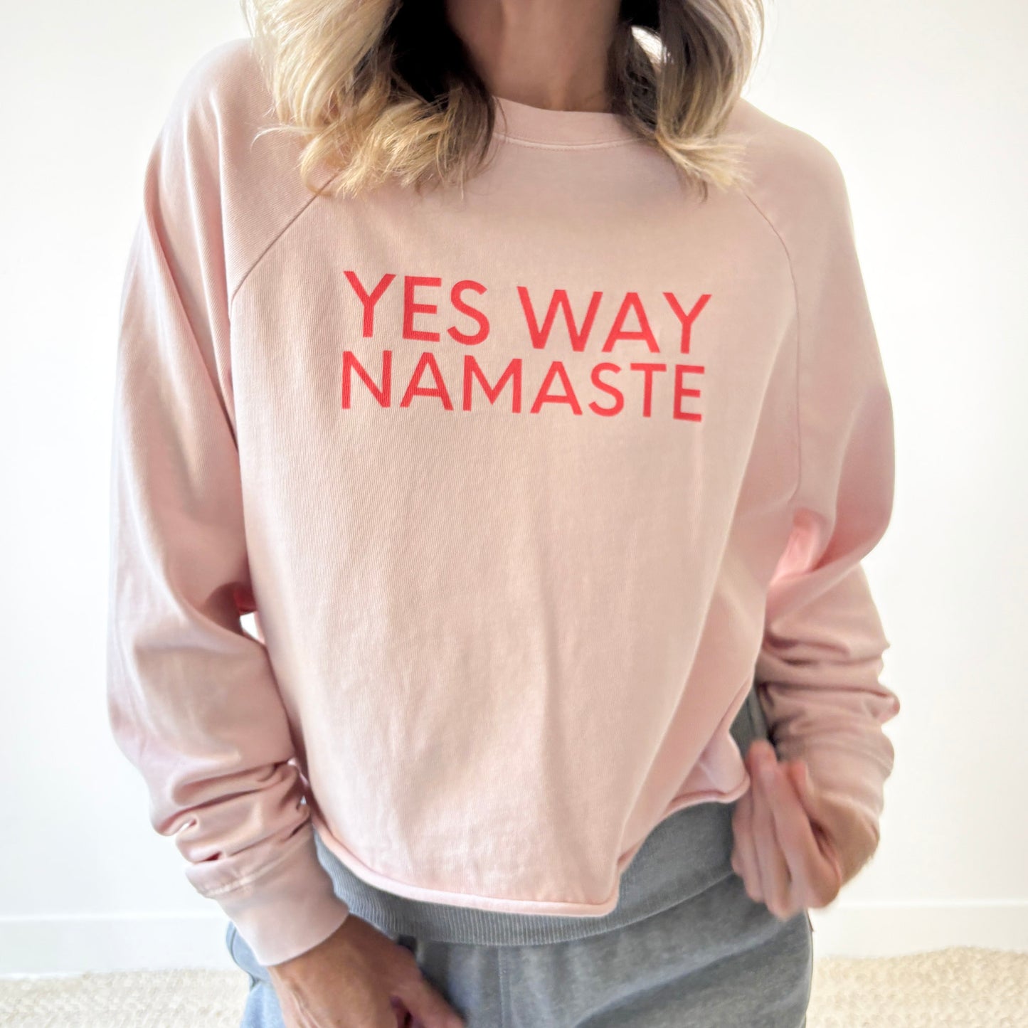 Light pink long raglan sleeve t shirt with raw hem and yes way namaste bright coral print