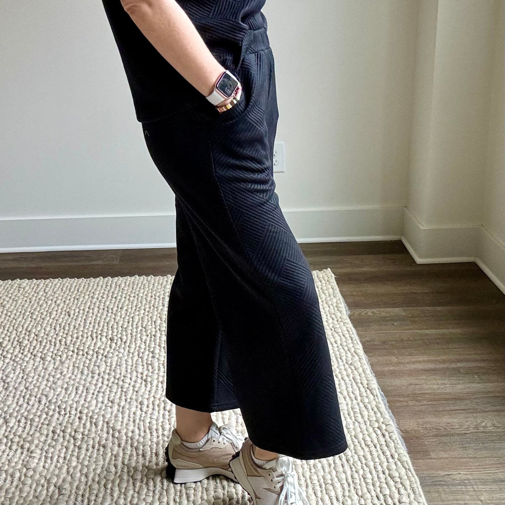 Black textured fabric pull on wide leg cropped pant with pockets