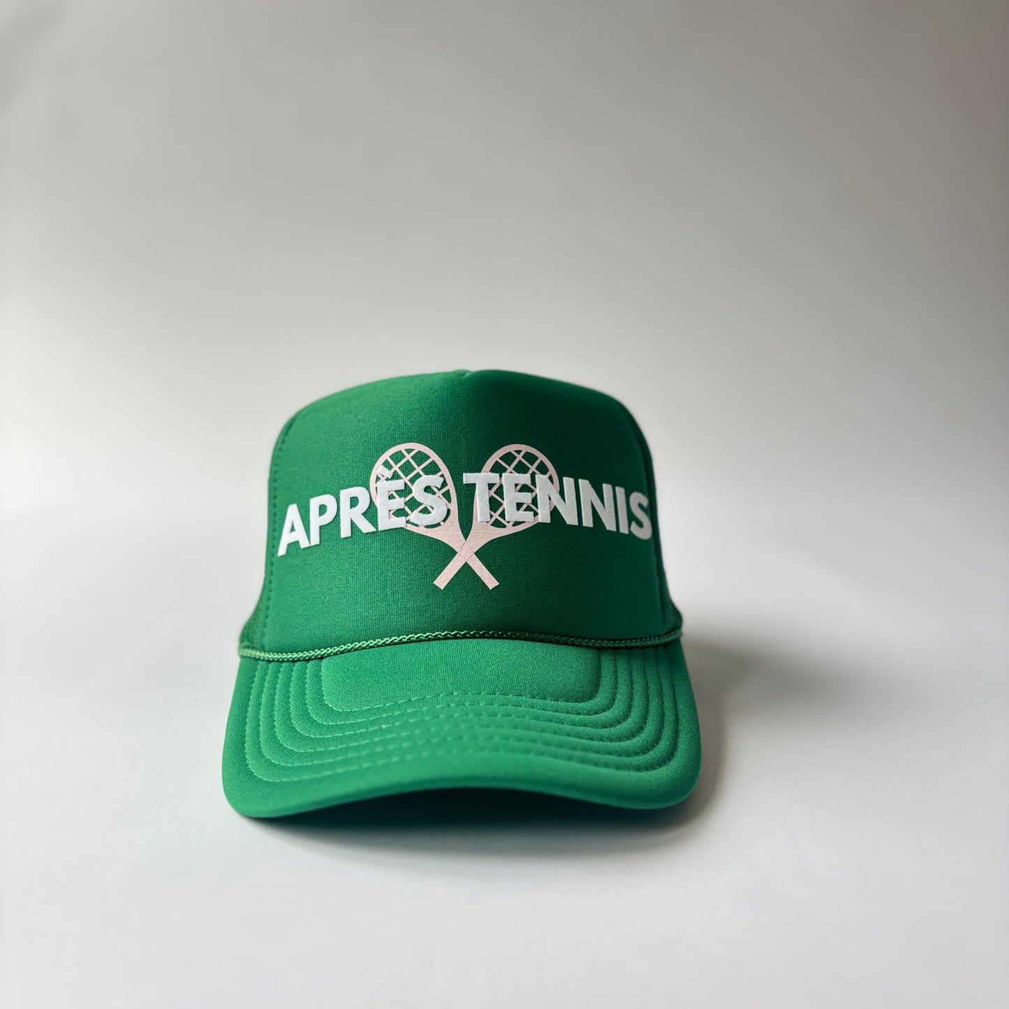 Kelly Green mid profile foam trucker hat with white flocked apres tennis and light pink tennis racket print